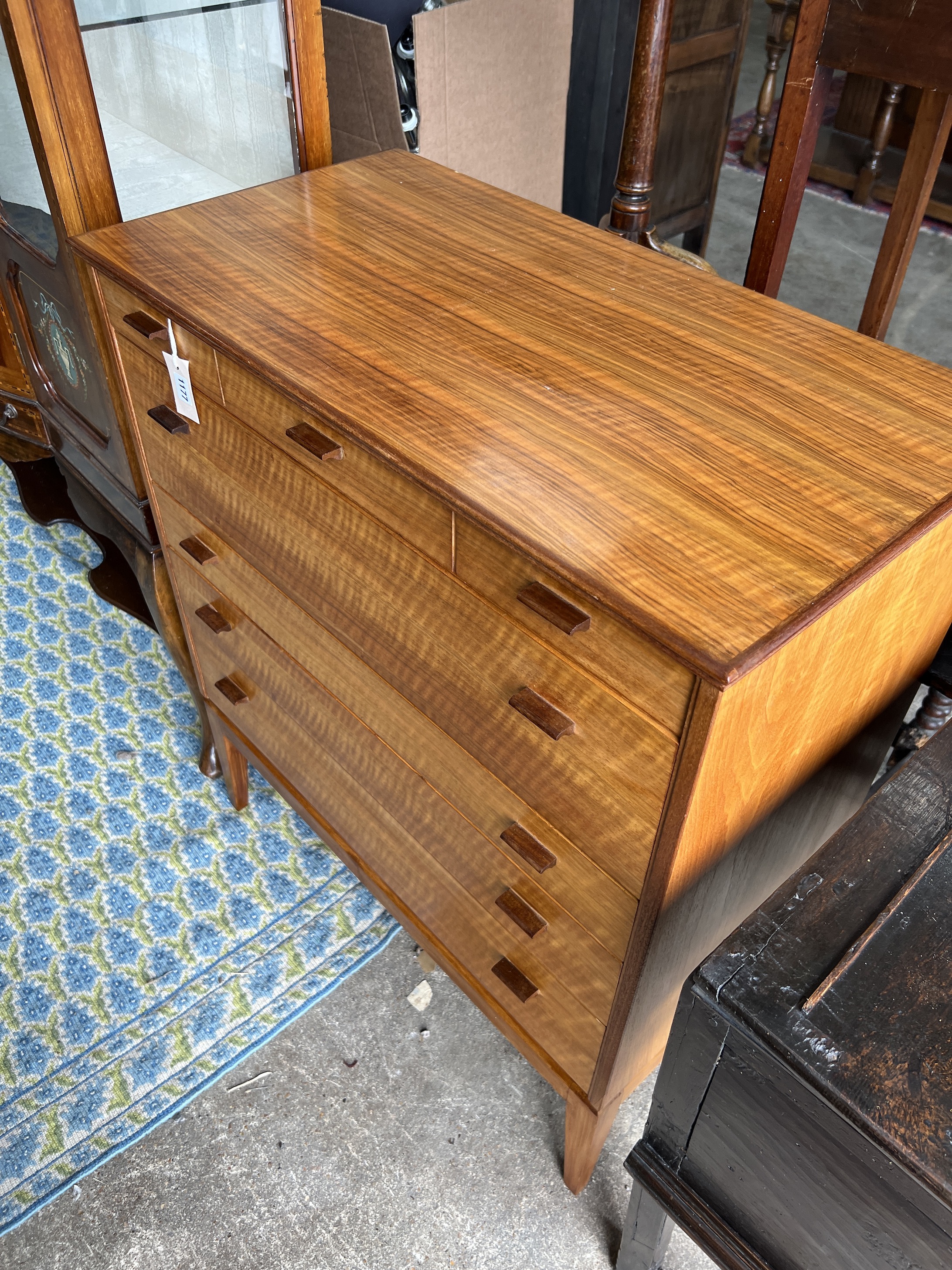 Attributed to Alfred Cox for Heals. A mid century walnut five drawer chest, width 85cm, depth 44cm, height 99cm